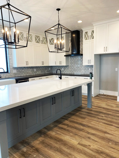 Full white and gray cabinets with black accessories
